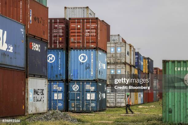 Containers sit stacked in a yard at Krishnapatnam Port in Krishnapatnam, Andhra Pradesh, India, on Friday, Aug. 11, 2017. Growth in gross domestic...