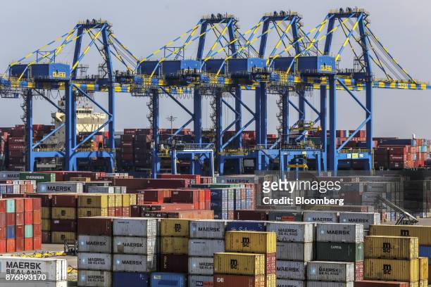 Containers sit stacked next to gantry cranes at Krishnapatnam Port in Krishnapatnam, Andhra Pradesh, India, on Friday, Aug. 11, 2017. Growth in gross...