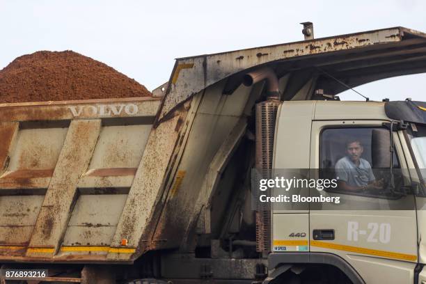 Driver sits in the cabin of a truck laden with iron ore at Krishnapatnam Port in Krishnapatnam, Andhra Pradesh, India, on Saturday, Aug. 12, 2017....