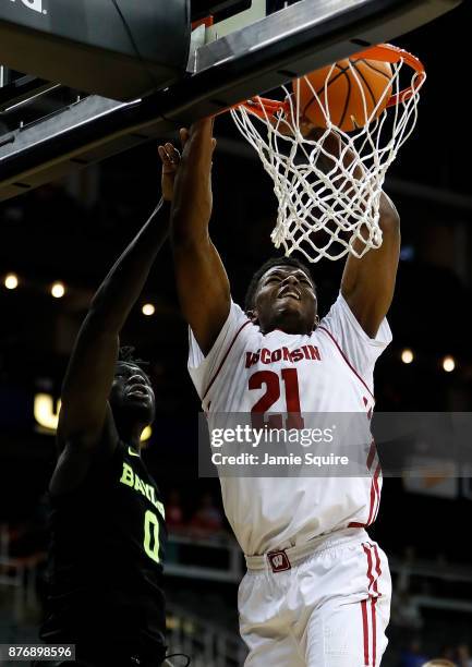 Khalil Iverson of the Wisconsin Badgersmisses a dunk as Jo Lual-Acuil Jr. #0 of the Baylor Bears defends during the game National Collegiate...