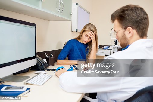 Sad Young Woman Listening to Doctor Sad Young Woman Listening to Doctor