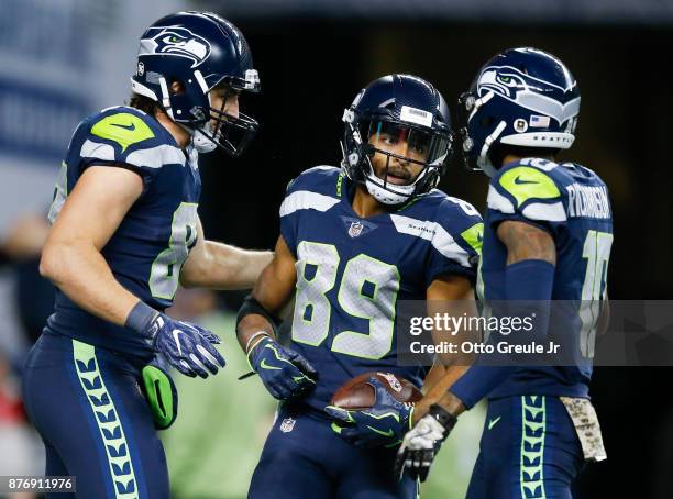 Wide receiver Doug Baldwin of the Seattle Seahawks is greeted by Luke Willson and Paul Richardson after his fourth quarter touchdown against the...