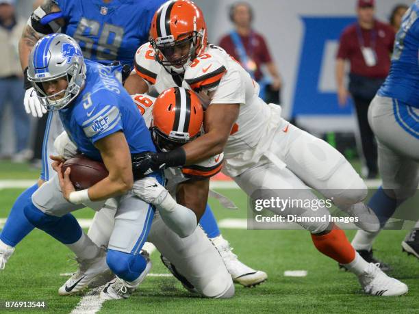 Defensive ends Emmanuel Ogbah and Myles Garrett of the Cleveland Browns sack quarterback Matthew Stafford of the Detroit Lions in the first quarter...