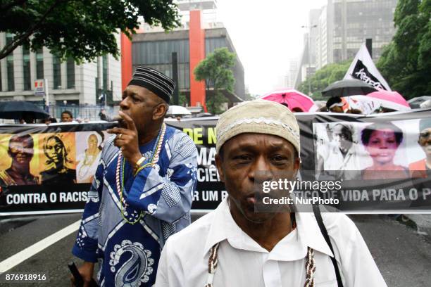 People participate in the 14th March of Consciência Negra, on Avenida Paulista, in Sao Paulo, Brazil, on the afternoon of 20 November 2017. The day...