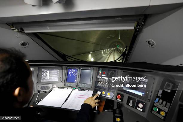 Driver operates a Korea Train Express Sancheon high-speed train, manufactured by Hyundai Rotem Co., during a media tour travelling to Gangneung,...