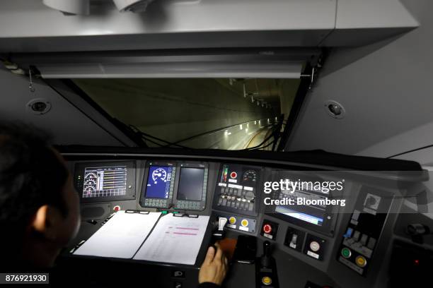 Driver operates a Korea Train Express Sancheon high-speed train, manufactured by Hyundai Rotem Co., during a media tour travelling to Gangneung,...