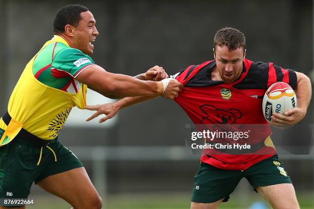 James Maloney is tackeld by Tyson Frizell during an Australian Kangaroos Rugby League World Cup training session at Langlands Park on November 21,...