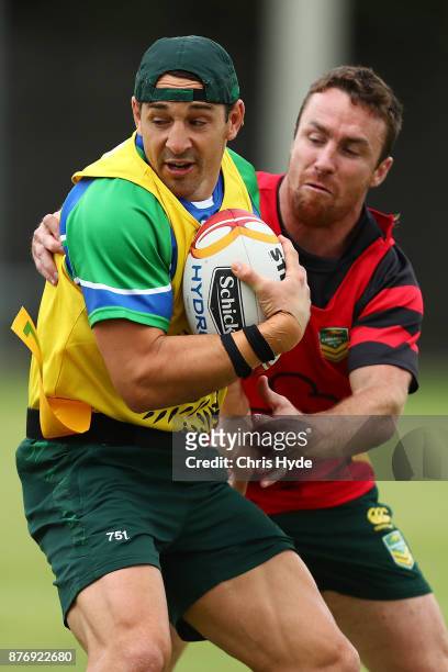 Billy Slater is tackled by James Maloney during an Australian Kangaroos Rugby League World Cup training session at Langlands Park on November 21,...