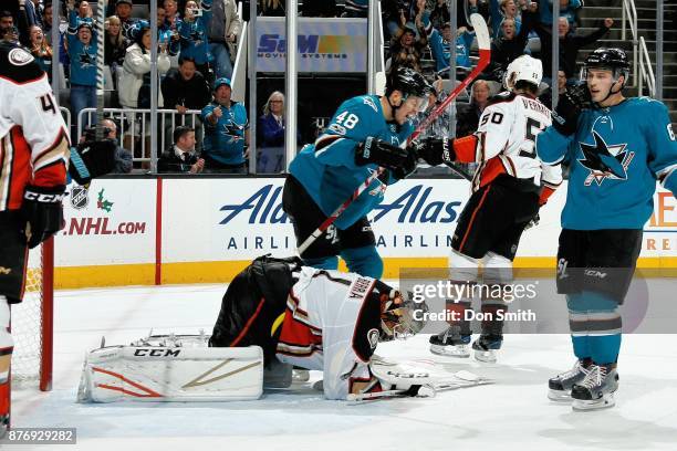 Tomas Hertl of the San Jose Sharks and Reto Berra of the Anaheim Ducks react after Joonas Donskoi of the San Jose Sharks scores a third period goal...