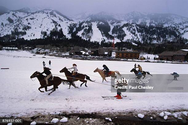 usa, wyoming, teton, skiers pulled by horses at cowboy ski challenge - teton village stock-fotos und bilder
