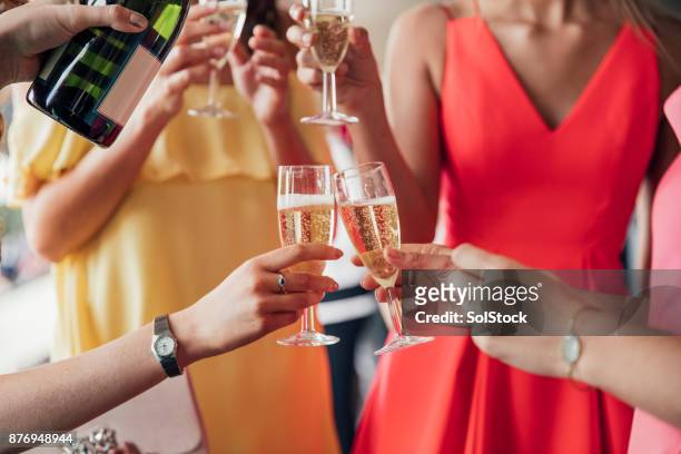 pouring champagne with friends - champagne party stock pictures, royalty-free photos & images