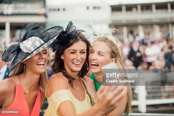 young women taking a selfie - ladies day stock pictures, royalty-free photos & images