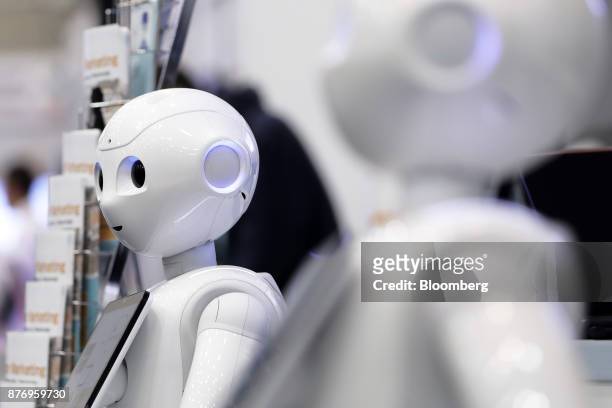 SoftBank Group Corp. Pepper humanoid robot stands at the SoftBank Robot World 2017 in Tokyo, Japan, on Tuesday, Nov. 21, 2017. SoftBank Chief...
