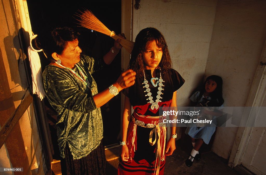 Native American girl getting her hair combed for pow-wow,Arizona,USA