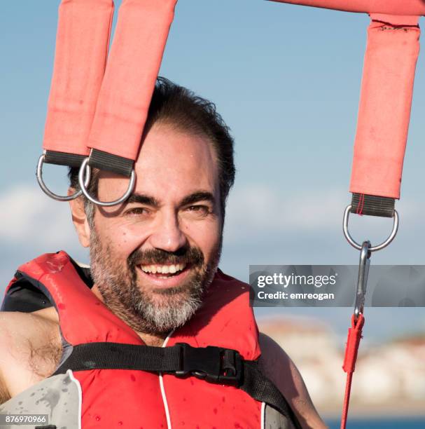 parasailing - emreogan stock pictures, royalty-free photos & images