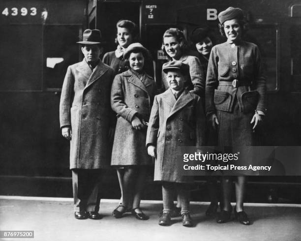 The children of US Ambassador Joseph P Kennedy at Victoria Station, London, on their way to attend the coronation of Pope Pius XII in Rome, 8th March...