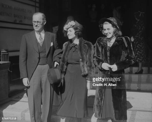 Ambassador Joseph P Kennedy in London with his wife Rose and daughter Kathleen, London, 19th March 1938. They are attending the wedding of William...