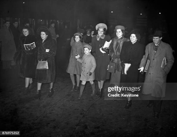 Rose Kennedy at Victoria Station in London with her children, 22nd December 1938. They are travelling to St Moritz for Christmas.