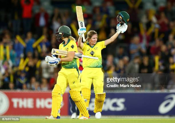 Beth Mooney of Australia celebrates scoring a century during the Third Women's Twenty20 match between Australia and England at Manuka Oval on...