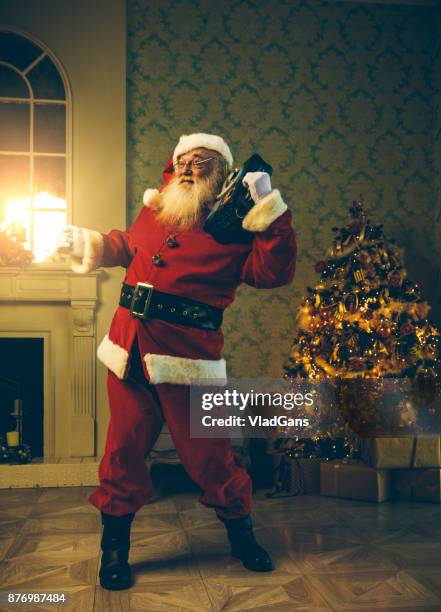 santa is listening to music - funny gifts stock pictures, royalty-free photos & images