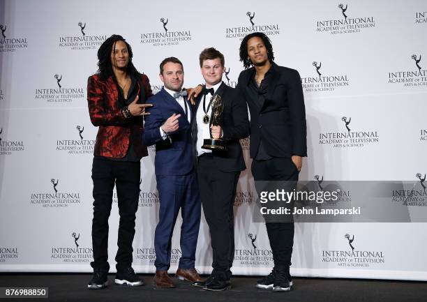 Wim Janseen and Kamiel De Bruyne pose with an award for Best Non-Scripted Entertainment for 'Sorry Voor Alles,' with Les Twins, Laurent and Larry...