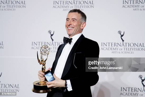 Steve Coogan poses with the award for Best Comedy for 'Alan Partridge's Scissored Isle' during 45th International Emmy Awards at New York Hilton on...