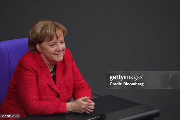 Angela Merkel, Germany's chancellor, reacts inside the lower-house of the German Parliament in Berlin, Germany, on Tuesday, Nov. 21, 2017. Merkel...