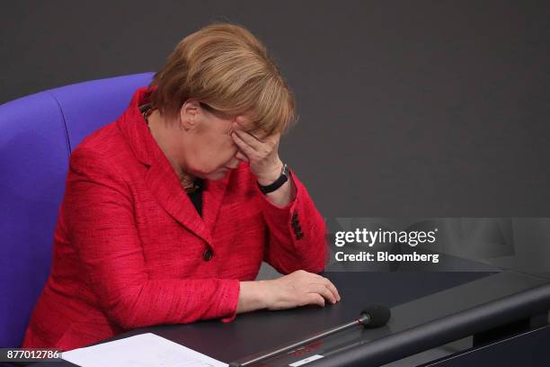 Angela Merkel, Germany's chancellor, reacts inside the lower-house of the German Parliament in Berlin, Germany, on Tuesday, Nov. 21, 2017. Merkel...