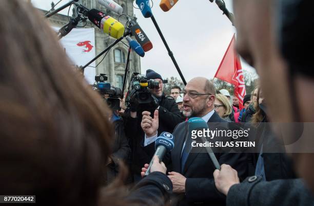 Leader of the Social Democratic Party , Martin Schulz talk to employees of German industrial conglomerate Siemens who demonstrate in front of the...