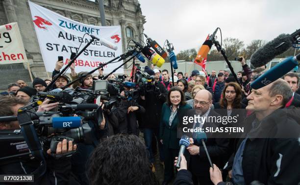Leader of the Social Democratic Party , Martin Schulz and parliamentary group leader of the Social Democratic Party , Andrea Nahles talk to employees...