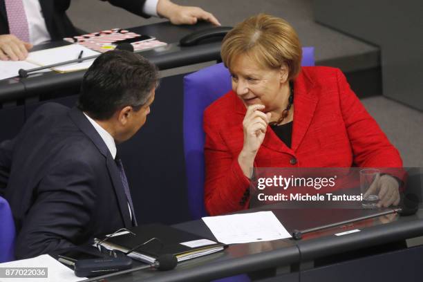 German Chancellor and leader of the German Christian Democrats Angela Merkel speaks with Sigmar Gabriel, Foreign minister of the Social Democrats...