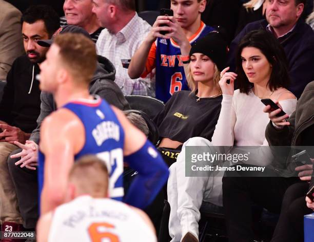 Hailey Baldwin and Kendall Jenner watch Blake Griffin during the Los Angeles Clippers Vs New York Knicks game at Madison Square Garden on November...