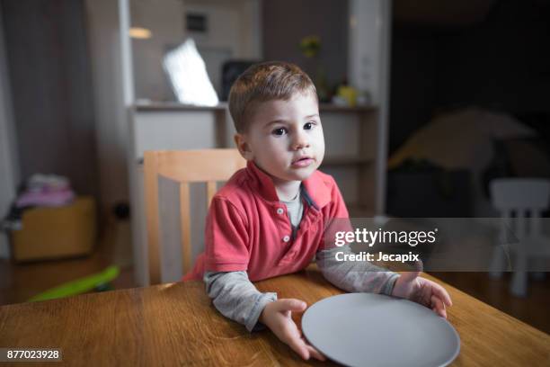 little boy waiting for his dinner - kid waiting stock pictures, royalty-free photos & images