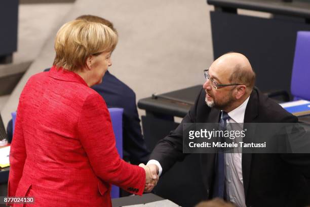 German Chancellor and leader of the German Christian Democrats Angela Merkel speaks with Martin Schulz, leader of the Social Democrats Party or...
