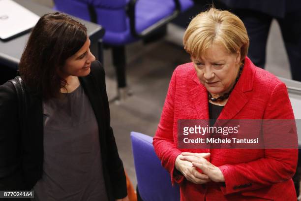 German Chancellor and leader of the German Christian Democrats Angela Merkel speaks with Katja Suding of the FDP party during the first session of...