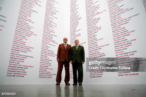 British artists Gilbert Proesch and George Passmore pose for pictures during the press preview of their latest exhibition entitled "The Beard...