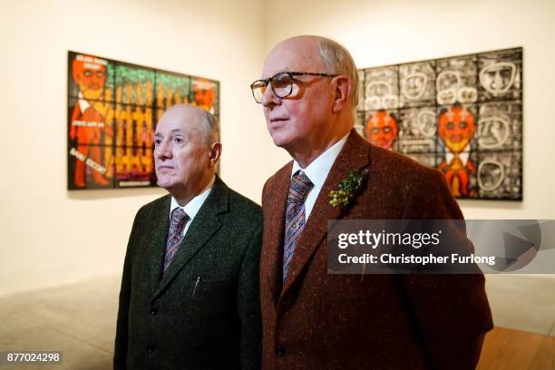 British artists Gilbert Proesch and George Passmore pose for pictures during the press preview of their latest exhibition entitled "The Beard...