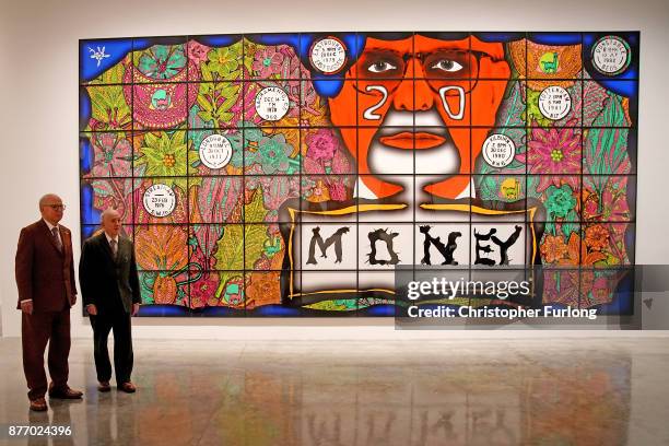 British artists Gilbert Proesch and George Passmore pose for pictures during the press preview of their latest exhibition entitled "The Beard...