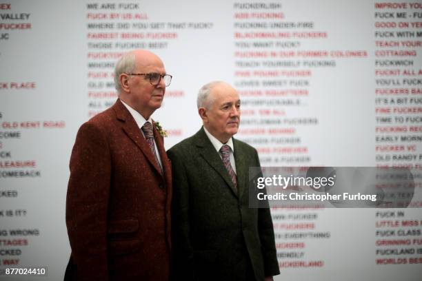 British artists Gilbert Proesch and George Passmore pose for pictures during the press preview of their latest exhibition entitled "The Beard...