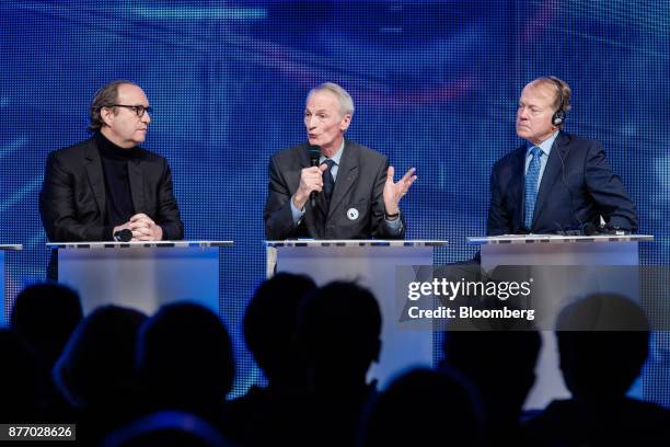 Jean-Dominique Senard, chief executive officer of Michelin & Cie., center, speaks as Xavier Niel, billionaire and deputy chairman of Iliad SA, left,...