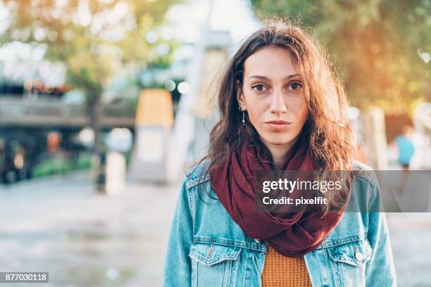portrait of a serious woman on the street - solemn face stock pictures, royalty-free photos & images