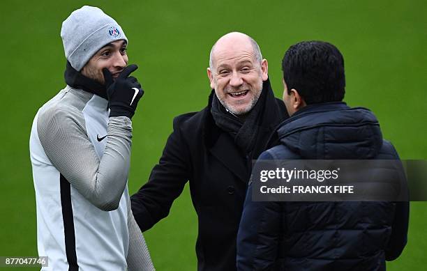Paris Saint-Germain's Argentinian forward Javier Pastore jokes with Paris Saint-Germain's Qinari president Nasser Al-Khelaifi and Paris...