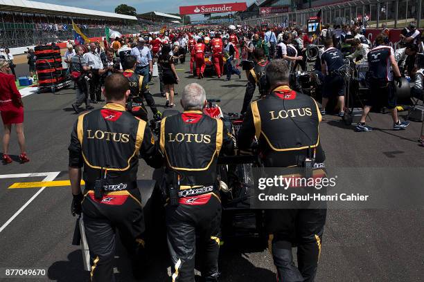 Kimi Raikkonen, Lotus-Renault E21, Grand Prix of Great Britain, Silverstone Circuit, 30 June 2013. Kimi Raikkonen being pushed by his Lotus-Renault...