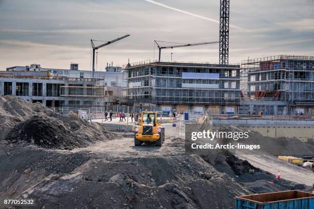 construction site, reykjavik, iceland - crane construction machinery stock-fotos und bilder