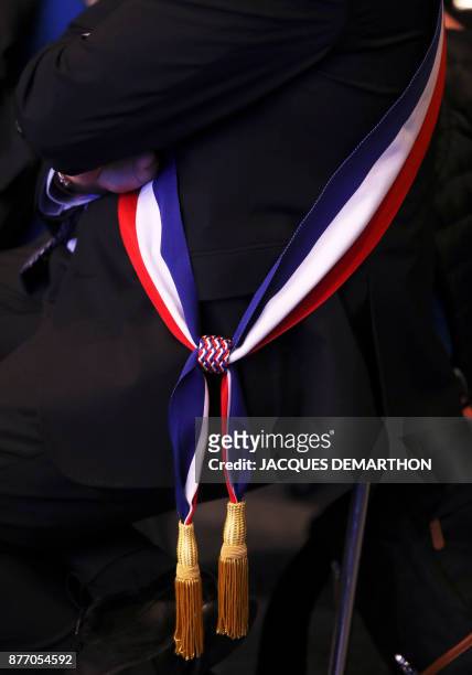 Mayor wears a tricolour mayoral sash during the 100th French Mayors congress on November 21, 2017 in Paris.