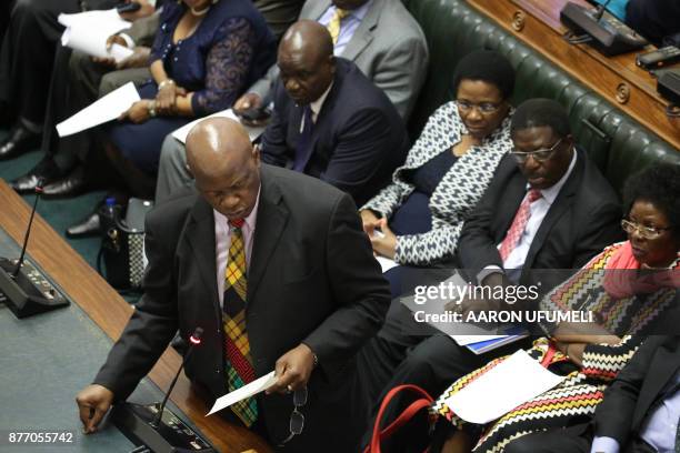 Member of Parliament Patrick Chinamasa moves forward a motion to impeach Zimbabwe President during a parliamentary session on November 21, 2017 at...