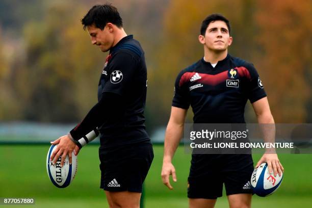 France's national rugby union team players French fly-half François Trinh-Duc and French fly-half Anthony Belleau attend a training session on...