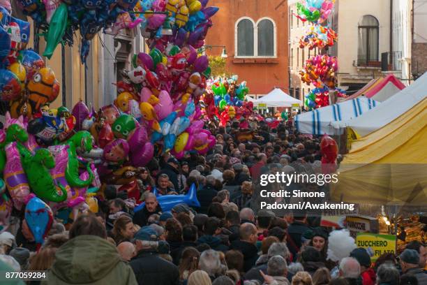 Pilgrims and tourists visit the stands next to Madonna della Salute church on the day of the traditional Festa della Salute on November 21, 2017 in...