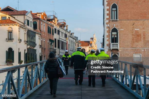 Police patrol the votive bridge on the day of the traditional Festa della Salute on November 21, 2017 in Venice, Italy. The Festa della Salute is the...