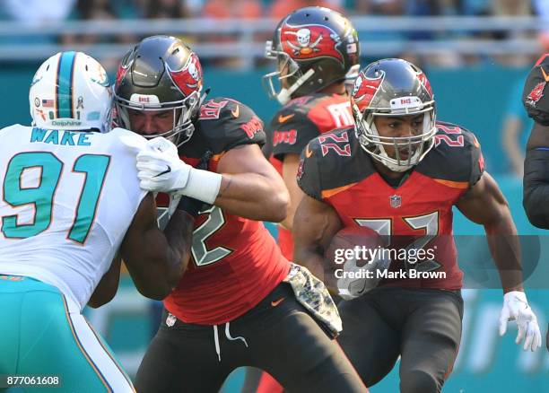 Doug Martin of the Tampa Bay Buccaneers runs the ball during the second quarter against the Miami Dolphins at Hard Rock Stadium on November 19, 2017...